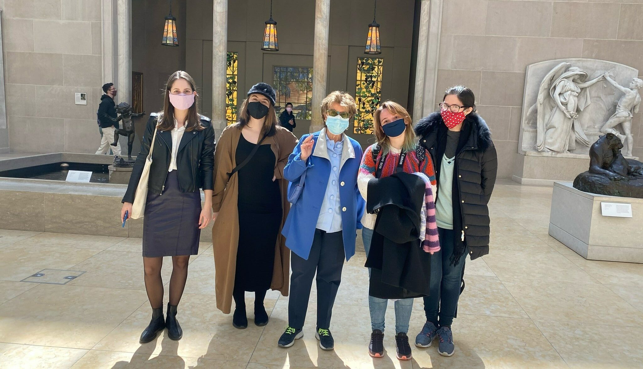 A group of students pose in an art museum