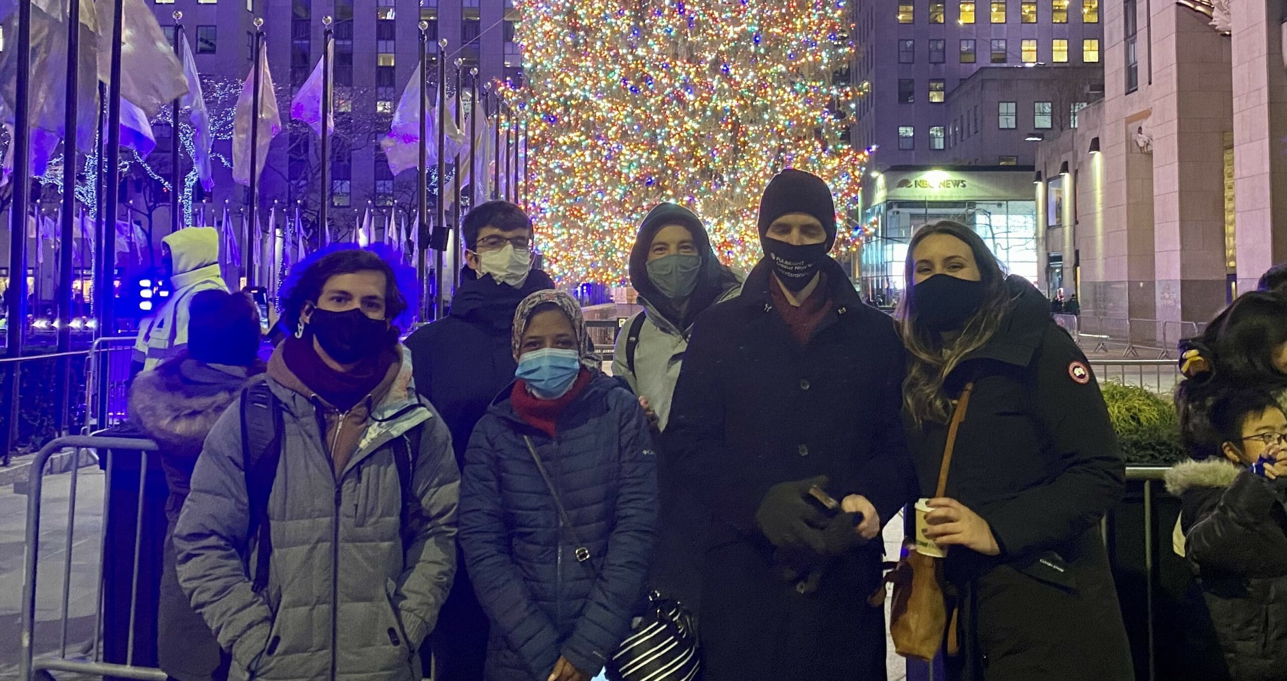 Students pause for a group photo in front of the Rockefeller Center Christmas Tree